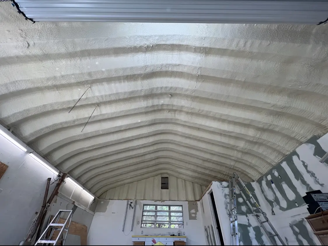 Spray polyurethane foam applied to the underside of a metal roof deck in Banning